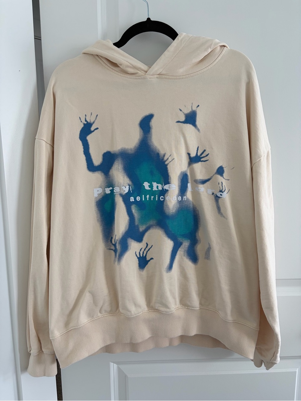 Aelfric Eden Cream Hoodie with Blue and Teal Graphic